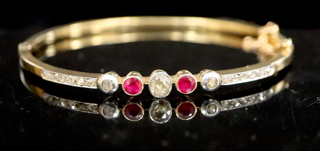 An Edwardian gold, ruby, old and rose cut diamond set hinged bracelet,